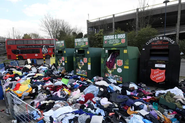 Clothing donation containers are seen as the spread of the coronavirus disease (COVID-19) continues, London, Britain, March 31, 2020. (Photo by Toby Melville/Reuters)