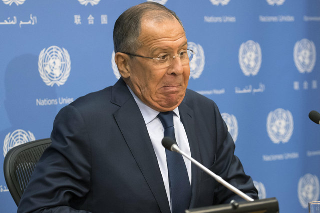 Russian Foreign Minister Sergey Lavrov reacts as he sits on a wobbly chair as he arrives for a news conference at United Nations headquarters, Friday, September 22, 2017. (Photo by Mary Altaffer/AP Photo)