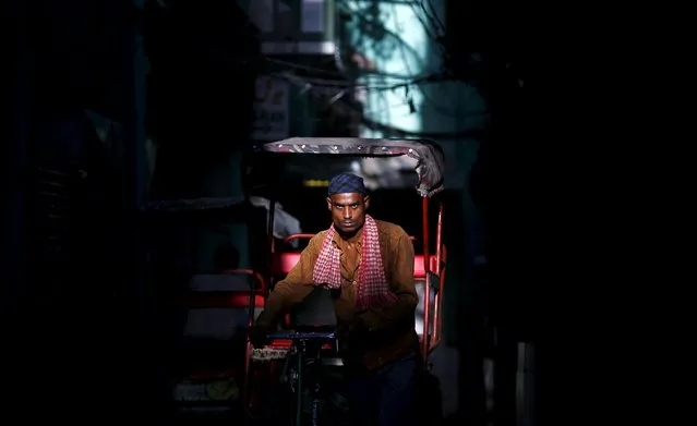 A rickshaw puller passes through an alley, in the old quarters of Delhi, India, August 26, 2015. (Photo by Adnan Abidi/Reuters)
