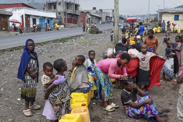 Children queue to fetch water at a water point, as schools remain closed down due to conflicts on the outskirts of Goma, Democratic Republic of the Congo, 04 February 2025. (Photo by EPA/EFE/Stringer)