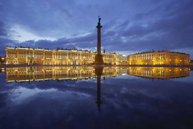 Winter Palace and the Alexander Column are reflected in a puddle after the rain at the Palace Square in St. Petersburg, Russia, Monday, April 27, 2020. (Photo by Dmitri Lovetsky/AP Photo)
