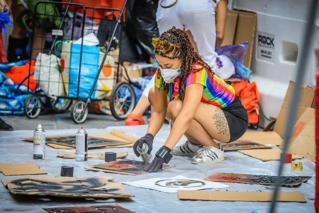 A protester prepares for a Black Trans Lives Matter rally in New York on June 27, 2020. (Photo by Vanessa Carvalho/Rex Features/Shutterstock)