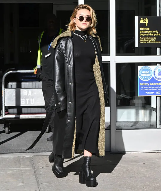 Florence Pugh is pictured making a stylish arrival at JFK airport in New York City on November 8, 2022. The 26 year old actress carried a Gucci bag and wore a leather trench coat, black dress, and matching platform boots. (Photo by The Image Direct)
