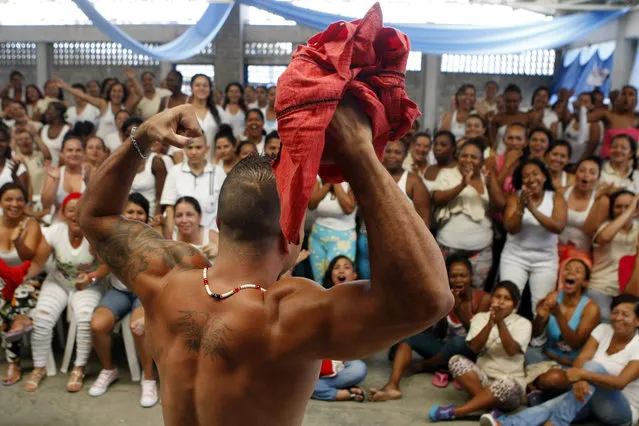 A picture made available on 23 September a prisoner of the Prison Complex Jamundi celebrating after winning the beauty contest “Mr. Muscle” in Jamundi, Colombia, on 22 September 2015. Candidates of the contest are prisoner of different pavilions of the male jail. INPEC (National Penitentiary and Prison Institute) organized the event in order to create opportunities for socialization between male and female prisoners. (Photo by Christian Escobar Mora/EPA)