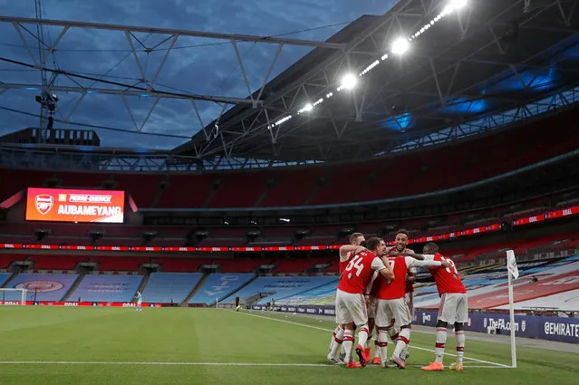 Pierre-Emerick Aubameyang celebrates with teammates after scoring his and Arsenal’s second goal during the FA Cup semi-final at an empty Wembley stadium in London, England on July 18, 2020. (Photo by Tom Jenkins/The Guardian)