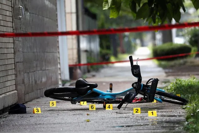 Chicago Police shell casing markers are seen, where a 37-year-old man riding a bicycle was shot and pronounced dead at the hospital according to local media reports, at the West Side of Chicago, Illinois, U.S., July 26, 2020. (Photo by Shannon Stapleton/Reuters)