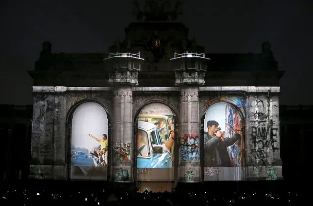 The video mapping "Sounds and Lights of Unity" is projected on the Arcades of Cinquantenaire to celebrate the 25th anniversary of German reunification, in Brussels, Belgium, October 1, 2015. (Photo by Francois Lenoir/Reuters)