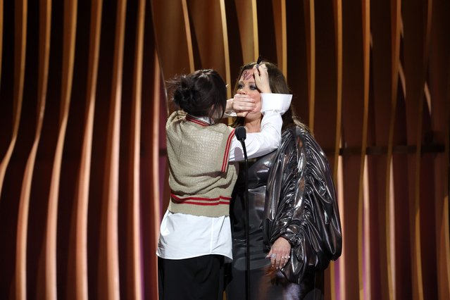 American singer-songwriter Billie Eilish signs American actress Melissa McCarthy’s forehead on stage during the 30th Annual Screen Actors Guild Awards at Shrine Auditorium and Expo Hall on February 24, 2024 in Los Angeles, California. (Photo by Matt Winkelmeyer/Getty Images)