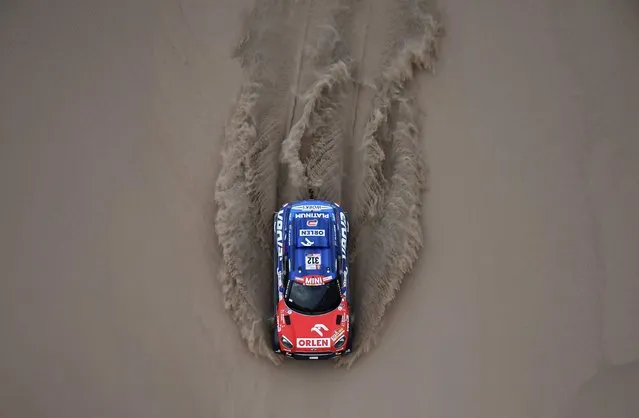 Mini's Polish driver Jakub Przygonski and Belgian co-driver Tom Colsoul compete during the 2018 Dakar Rally Stage 2 in and around the Peruvian town of Pisco, on January 7, 2018. The 40th edition of the Dakar Rally will take competitors through Peru, Bolivia and Argentina until January 20. (Photo by Franck Fife/AFP Photo)