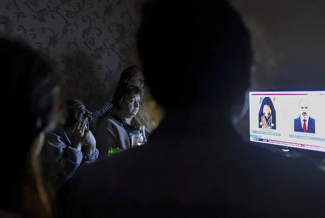 In this handout photo released by the Armenian Foreign Ministry on Monday, September 28, 2020, people watch the State TV as they gather in a bomb shelter for protection against the shelling in Stepanakert, the self-proclaimed Republic of Nagorno-Karabakh, Azerbaijan. Nagorno-Karabakh authorities reported that shelling hit the region's capital of Stepanakert and the towns of Martakert and Martuni. Armenian Defense Ministry spokesman Artsrun Hovhannisyan also said Azerbaijani shelling hit within Armenian territory near the town of Vardenis. (Photo by Armenian Foreign Ministry via AP Photo)