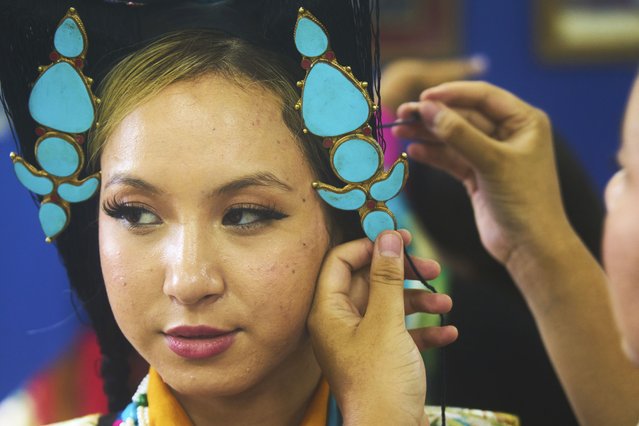 A Tibetan woman gets ready to perform at a cultural show during the 90th birthday celebration of spiritual leader the Dalai Lama at the Tibetan Camp in Kathmandu, Nepal, Sunday, July 6, 2025. (Photo by Niranjan Shrestha/AP Photo)