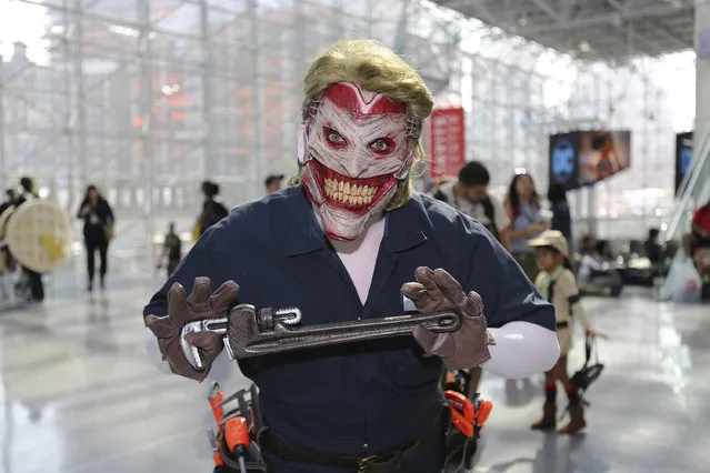 A fan dresses up in costume while attending the first day of New York Comic Con at the Javits Center on Thursday, October 6, 2016. (Photo by Steve Luciano/AP Photo)