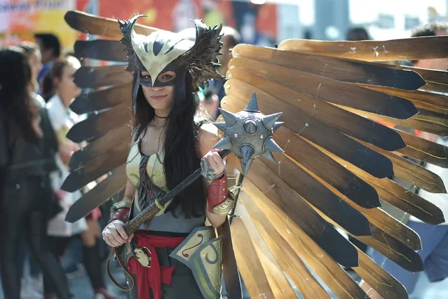 A cosplayer dressed as Iron Man attends the New York Comic Con 2016 at The Jacob K. Javits Convention Center on October 7, 2016 in New York City. New York Comic Con is one of the largest comic book and science fiction conventions. The convention brings together fans of fantasy role playing, science fiction, movies and television. (Photo by Neilson Barnard/Getty Images)