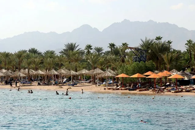 Tourists swim in the sea in the Red Sea resort of Sharm el-Sheikh, November 7, 2015. (Photo by Asmaa Waguih/Reuters)