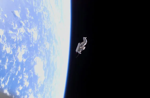Backdropped by the blackness of space and Earth’s horizon, a spacesuit-turned-satellite called SuitSat began its orbit around the Earth after it was released by the Expedition 12 crewmembers during a session of extravehicular activity (EVA) on February 3, 2006. SuitSat, an unneeded Russian Orlan spacesuit, was outfitted by the crew with three batteries, internal sensors and a radio transmitter, which faintly transmitted recorded voices of school children to amateur radio operators worldwide. The suit will enter the atmosphere and burn up in a few weeks. (Photo by NASA)