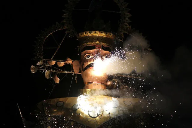 Fireworks explode from a burning effigy of demon king Ravana during Vijaya Dashmi or Dussehra festival celebrations in Ajmer, India, October 11, 2016. (Photo by Himanshu Sharma/Reuters)
