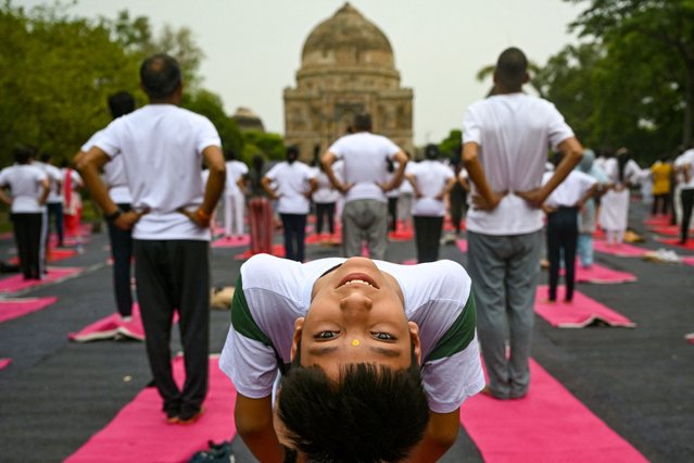 People take part in a yoga session at Lodhi gardens on International Day of Yoga, in New Delhi on June 21, 2024. (Photo by Arun Sankar/AFP Photo)