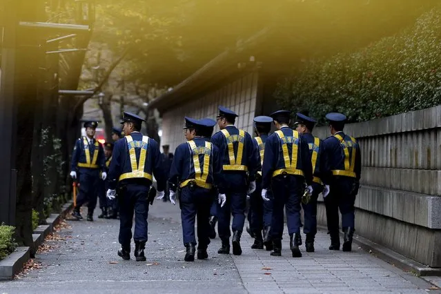 Police walk outside the Yasukuni shrine after a blast inside its compound in Tokyo, Japan, November 23, 2015. (Photo by Toru Hanai/Reuters)