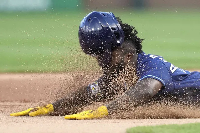 Tampa Bay Rays' Randy Arozarena slides safely into an unmanned second base during the first inning of a baseball game against the Chicago White Sox, Friday, April 28, 2023, in Chicago. (Photo by Charles Rex Arbogast/AP Photo)