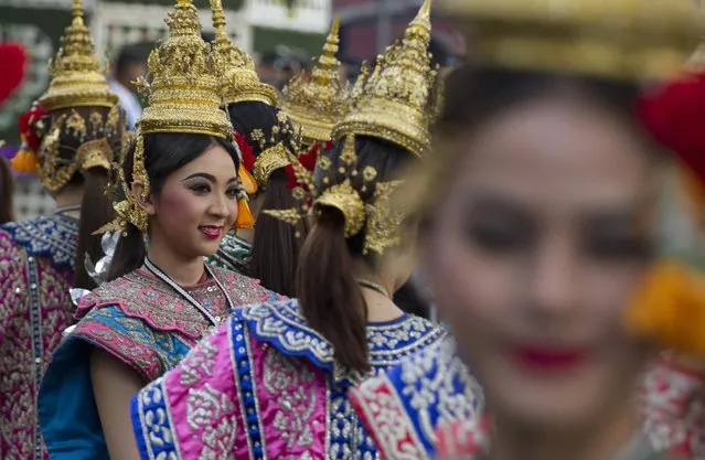 A Thai dancer performs during a parade held Wednesday, January 14, 2015 in Bangkok to promote tourism. The event was an effort by Thailand’s military-installed government to promote national pride and boost tourism. (Photo by Sakchai Lalit/AP Photo)