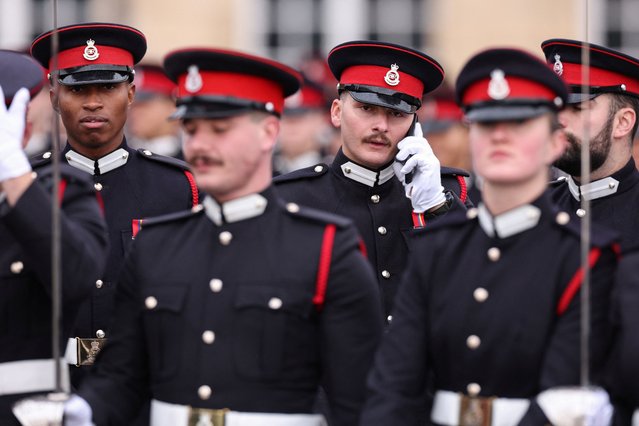 Officer Cadets form up on the grounds ahead of the traditional No. 251 Sovereign's Parade, at the Royal Military Academy in Sandhurst, southwest of London on December 12, 2025. The parade marks the completion of 44 weeks of intensive training for the Officer Cadets of Commissioning Course 251. (Photo by Adrian Dennis/AFP Photo)