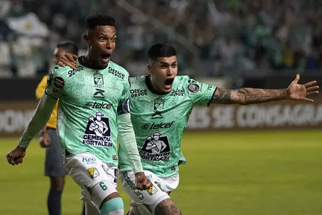 William Tesillo of Mexico's Leon, left, celebrates with teammate Adonis Frias, after scoring his team's first goal against Los Angeles FC during the first leg of the CONCACAF championship final soccer match at Leon stadium in Guanajuato, Mexico, Wednesday, May 31, 2023. (Photo by Eduardo Verdugo/AP Photo)