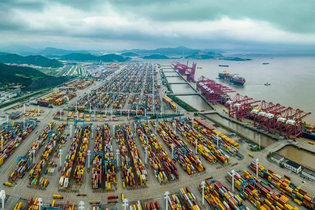 This aerial photo taken on June 6, 2023 shows shipping containers stacked at Zhoushan port in Ningbo, in China's eastern Zhejiang province. (Photo by AFP Photo/China Stringer Network)
