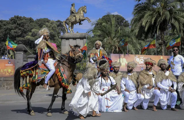 A theatrical troupe poses for a photograph on Adwa Victory Day, in the capital Addis Ababa, Ethiopia, Tuesday, March 2, 2021. The national public holiday marks the day when Ethiopian forces defeated the Italian forces in 1896, near the town of Adwa. (Photo by AP Photo/Stringer)