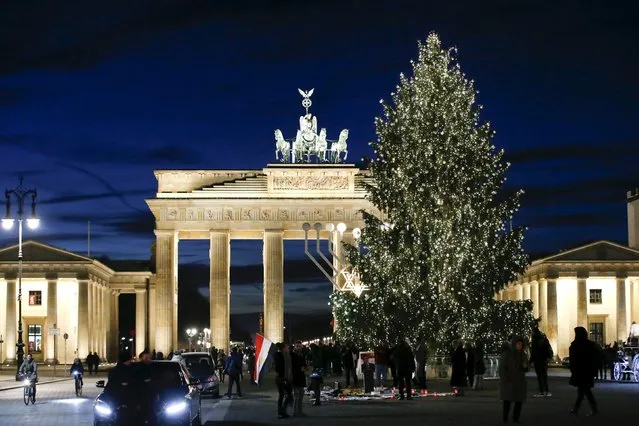 An illuminated Christmas tree is pictured in front of the Brandenburg Gate in Berlin, Germany, December 10, 2015. (Photo by Fabrizio Bensch/Reuters)