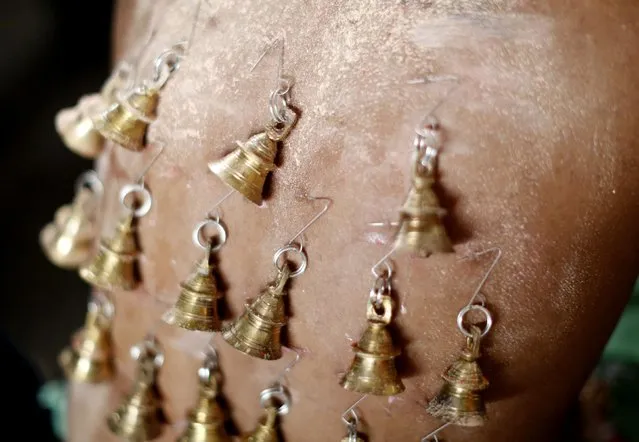 A Hindu devotee pierced with bells is seen before his pilgrimage to the Batu Caves temple during Thaipusam in Kuala Lumpur February 3, 2015. (Photo by Olivia Harris/Reuters)