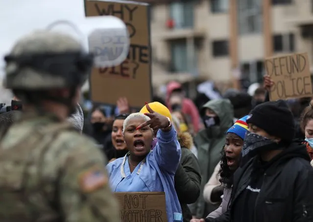 Protesters rally outside Brooklyn Center Police Department a day after Daunte Wright was shot and killed by a police officer, in Brooklyn Center, Minnesota, U.S. April 12, 2021. (Photo by Leah Millis/Reuters)