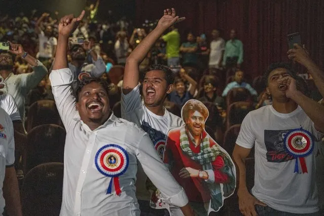 Fans of Indian superstar Rajinikanth, cheer at a cinema hall as they celebrate the screening of his latest film “Jailer” in Mumbai, India, Thursday, August 10, 2023. (Photo by Rafiq Maqbool/AP Photo)