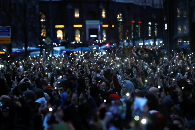 People hold their lit up mobile phones during a rally in support of jailed Russian opposition politician Alexei Navalny in Moscow, Russia, April 21, 2021. (Photo by Maxim Shemetov/Reuters)