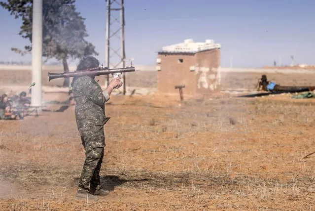 A female fighter of the Kurdish People's Protection Units (YPG) fires a Rocket-propelled grenade (RPG) as she participates in a military training in the western countryside of Ras al-Ain January 25, 2015. (Photo by Rodi Said/Reuters)