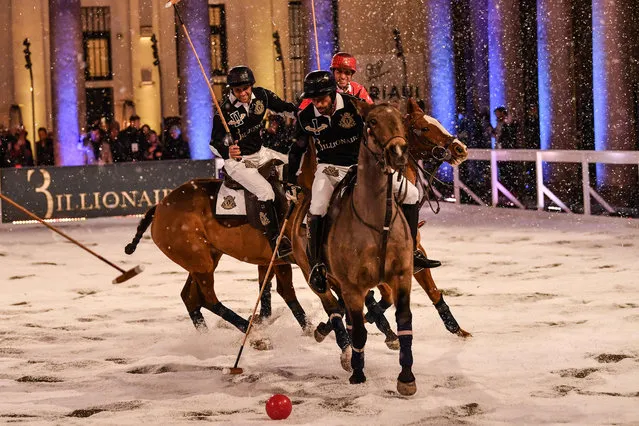 Polo players play a game within the presentation of fashion house Billionaire's Men's Fall/Winter 2019/20 fashion shows in Milan, on January 12, 2019. (Photo by Marco Bertorello/AFP Photo)