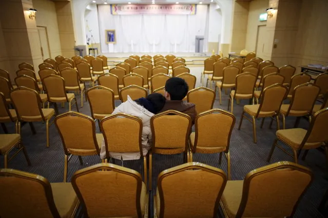A couple takes their seat before an orientation for the upcoming mass wedding ceremony of the Unification Church at a resort in Yangpyeong, South Korea, February 19, 2016. (Photo by Kim Hong-Ji/Reuters)