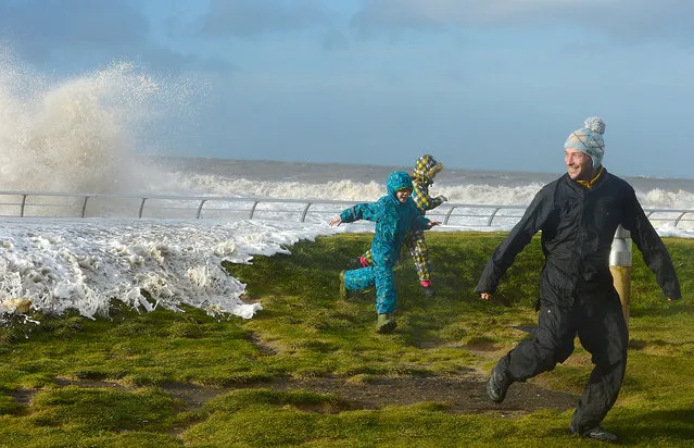 Waves crash over Blackpool seafront on January 3, 2014 in Blackpool, England. Gail force winds and an expected tidal surge are set to cause wide spread flooding in coastal areas of western England and Scotland.  (Photo by Nigel Roddis/Getty Images)