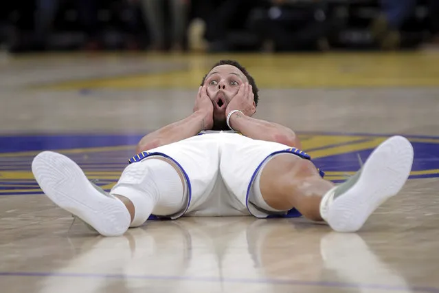Golden State Warriors' Stephen Curry reacts after hitting a 3-point shot and being fouled by the Orlando Magic during the first half of an NBA basketball game Tuesday, January 2, 2024, in San Francisco. (Photo by Carlos Avila Gonzalez/San Francisco Chronicle via AP Photo)