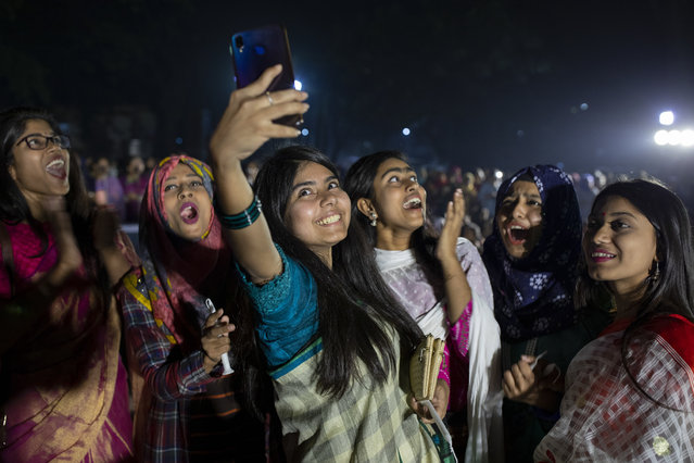Women attend a candle light event to mark International Women's Day in Dhaka, Bangladesh on March 7, 2019. (Photo by K.M. Asad/Zuma Wire/Rex Features/Shutterstock)