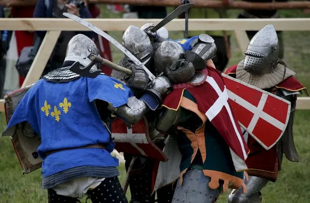 Fighters from France and Denmark compete in a “5 vs 5” competition at the Medieval Combat World Championship at Malbork Castle, northern Poland, April 30, 2015. (Photo by Kacper Pempel/Reuters)