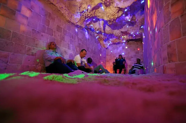 A group sits in the salt cave during a meditation session in Cairo, Egypt, November 14, 2016. (Photo by Mohamed Abd El Ghany/Reuters)