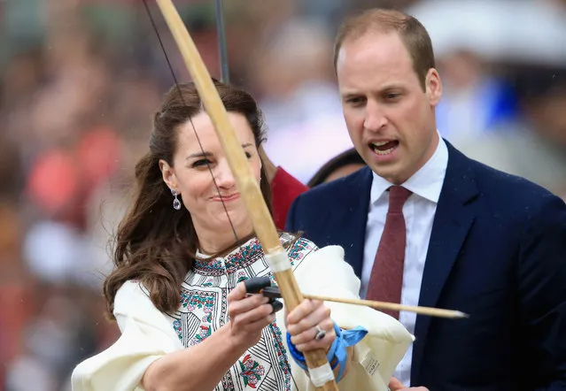 Prince William, Duke of Cambridge looks on as Catherine, Duchess of Cambridge fires an arrow during an Bhutanese archery demonstration on the first day of a two day visit to Bhutan on the 14th April 2016 in Paro, Bhutan. The Royal couple are visiting Bhutan as part of a week long visit to India and Bhutan that has taken in cities such as Mumbai, Delhi, Kaziranga, Bhutan and Agra. (Photo by Chris Jackson/Getty Images)