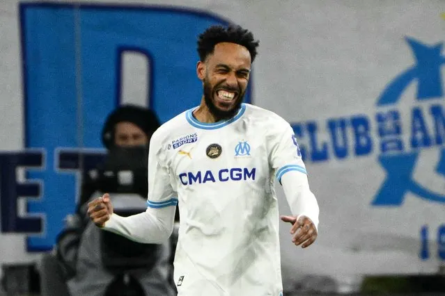 Marseille's French-Gabonese forward #10 Pierre-Emerick Aubameyang celebrates scoring his team's second goal from the penalty spot during the French L1 football match between Olympique de Marseille (OM) and OGC Nice at Stade Velodrome in Marseille, southern France on April 24, 2024. (Photo by Christophe Simon/AFP Photo)