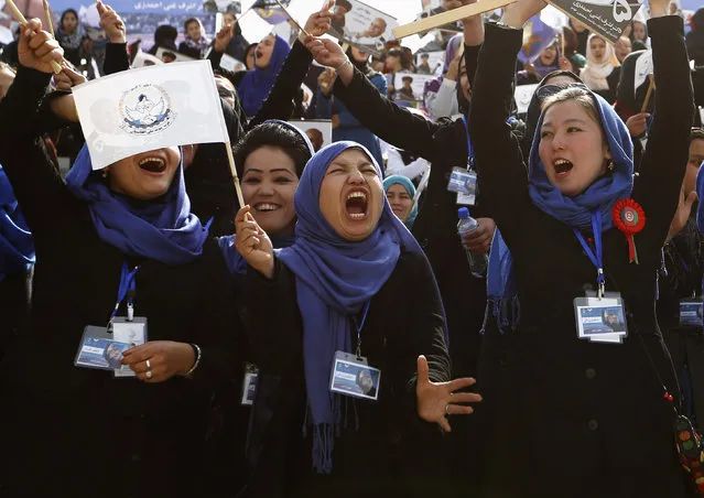 Supporters of Afghan presidential candidate Ashraf Ghani cheer during an election campaign in Kabul April 1, 2014. The Afghan presidential elections will be held on April 5. (Photo by Mohammad Ismail/Reuters)