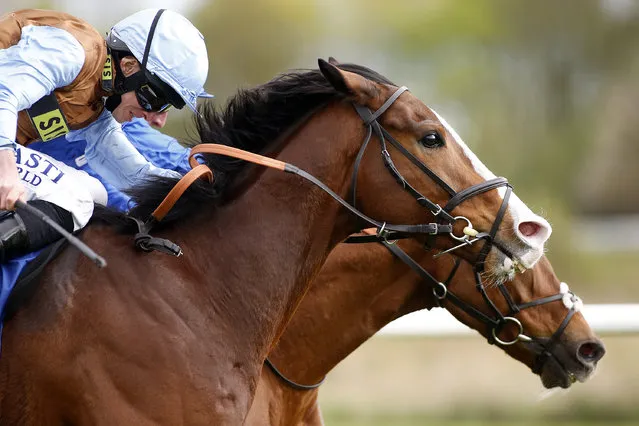 Ryan Moore riding George William (nearest) win The totepool Racecourse Debit Card betting Available Handicap Stakes from G K Chesterton (farside) at Nottingham Racecourse on April 12, 2017 in Nottingham, England. (Photo by Alan Crowhurst/Getty Images)