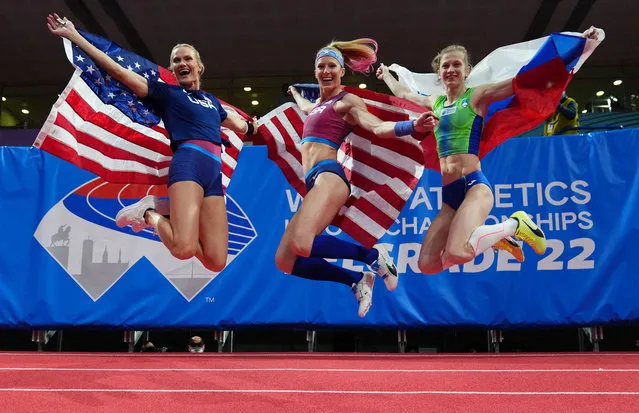 (L-R) Silver medallist US athlete Katie Nageotte, gold medllist US athlete Sandi Morris and bronze medallist Slovenia's Tina Sutej celebrate their victory at the end of the women's pole vault final during The World Athletics Indoor Championships 2022 at the Stark Arena, in Belgrade, on March 19, 2022. (Photo by Aleksandra Szmigiel/Reuters)
