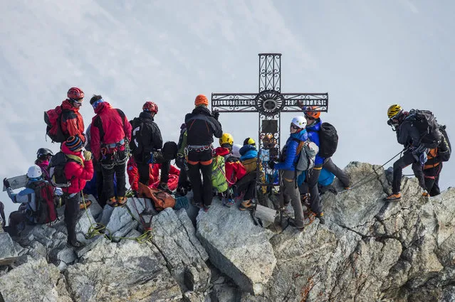 Delegations of the four nations Switzerland, Italy, France and Britain climb the Matterhorn mountain from different ridges in Zermatt, Switzerland, 17 July 2015. The ascent was held to commemorate the first race to the first ascent of the Matterhorn, also known as Mount Cervin. Zermatt opn 4 July celebrated 150 years since the first ascent of the Matterhorn, when British climber Edward Whymper reached the peak of the Matterhorn (4,478 metres above sea level) together with his rope team on 14 July 1865. (Photo by Dominic Steinmann/EPA)