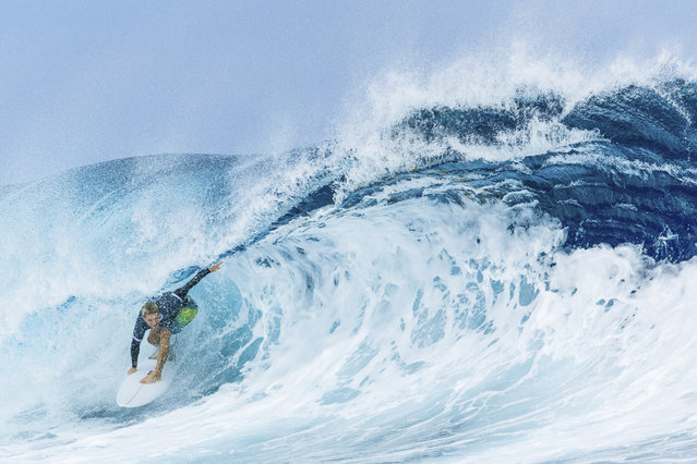 Ethan Ewing, of Australia, surfs on a training day ahead of the 2024 Summer Olympics surfing competition, Tuesday, July 23, 2024, in Teahupo'o, Tahiti. (Photo by Ed Sloane/Pool Photo via AP Photo)