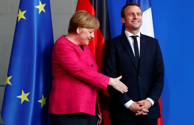 German Chancellor Angela Merkel and French President Emmanuel Macron shake hands after a news conference at the Chancellery in Berlin, Germany, May 15, 2017. (Photo by Fabrizio Bensch/Reuters)