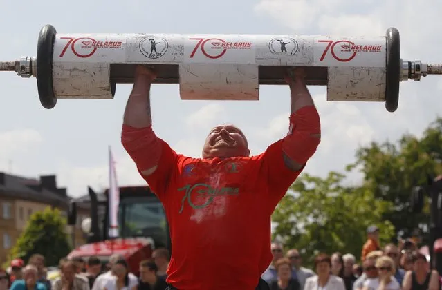 Russia's Sergei Shutov lifts a 140-kg barbel during the Strong men championship in Minsk, Saturday, May 28, 2016. The tournament is dedicated to the 70th anniversary of the Minsk tractor works. (Photo by Sergei Grits/AP Photo)